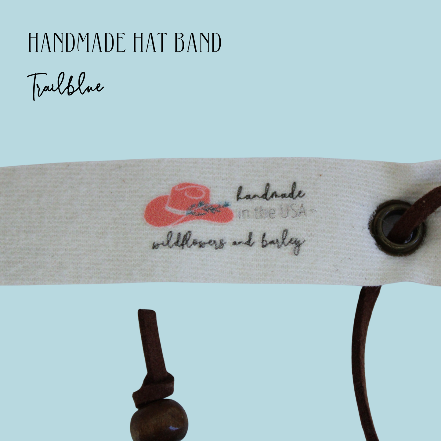 Handmade hat band with branding on a light blue background