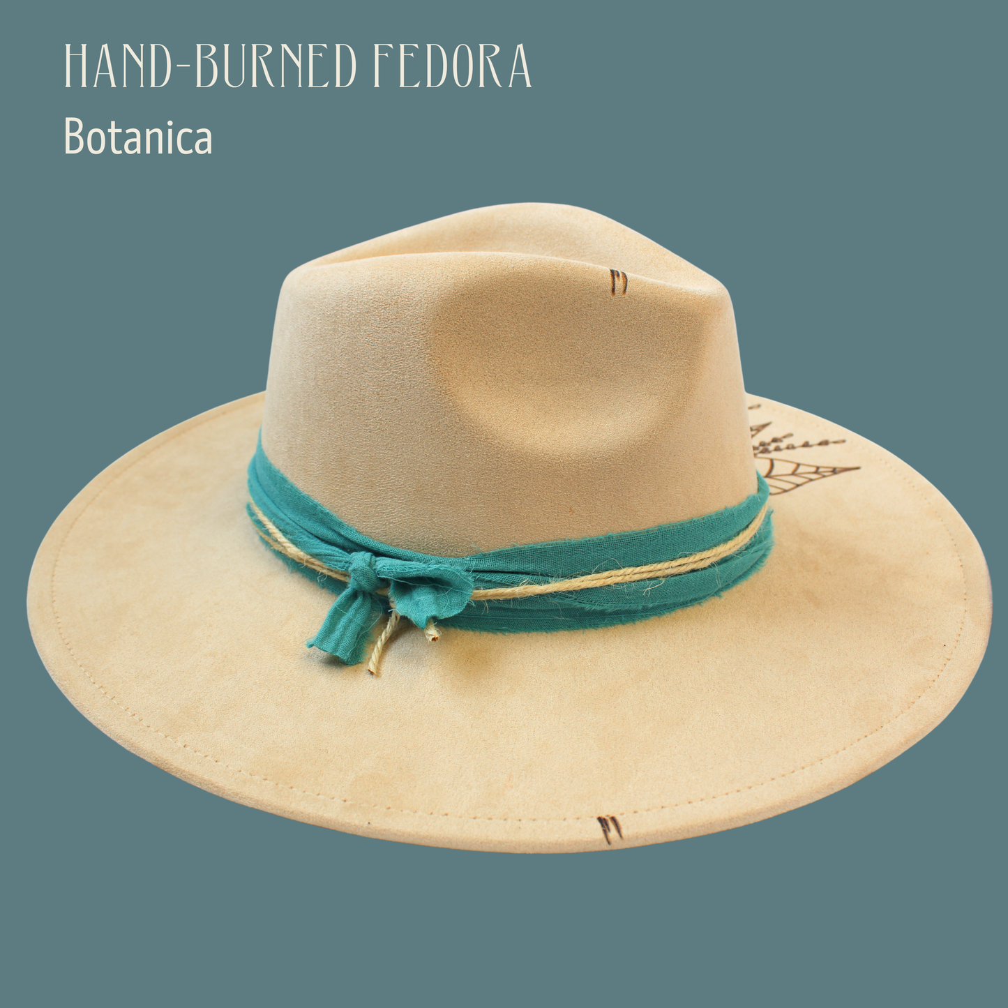 Beige fedora hat with a green band on a teal background