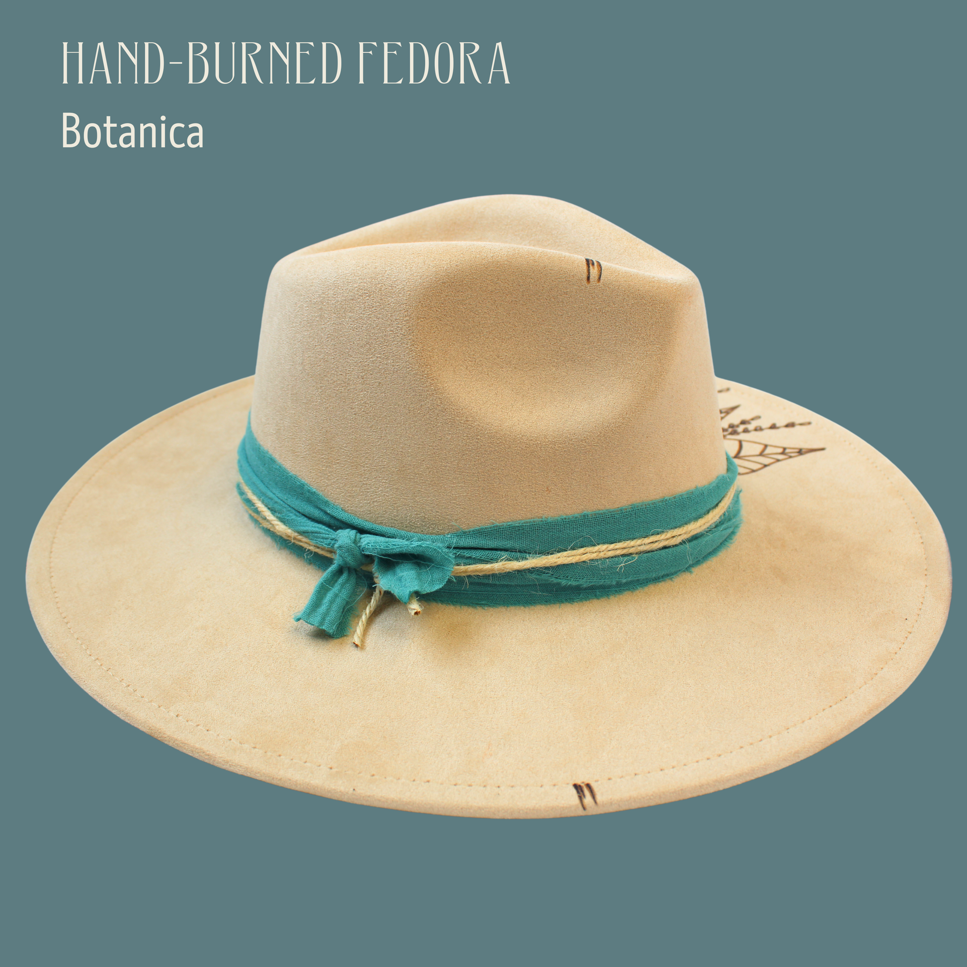 Beige fedora hat with a green band on a teal background
