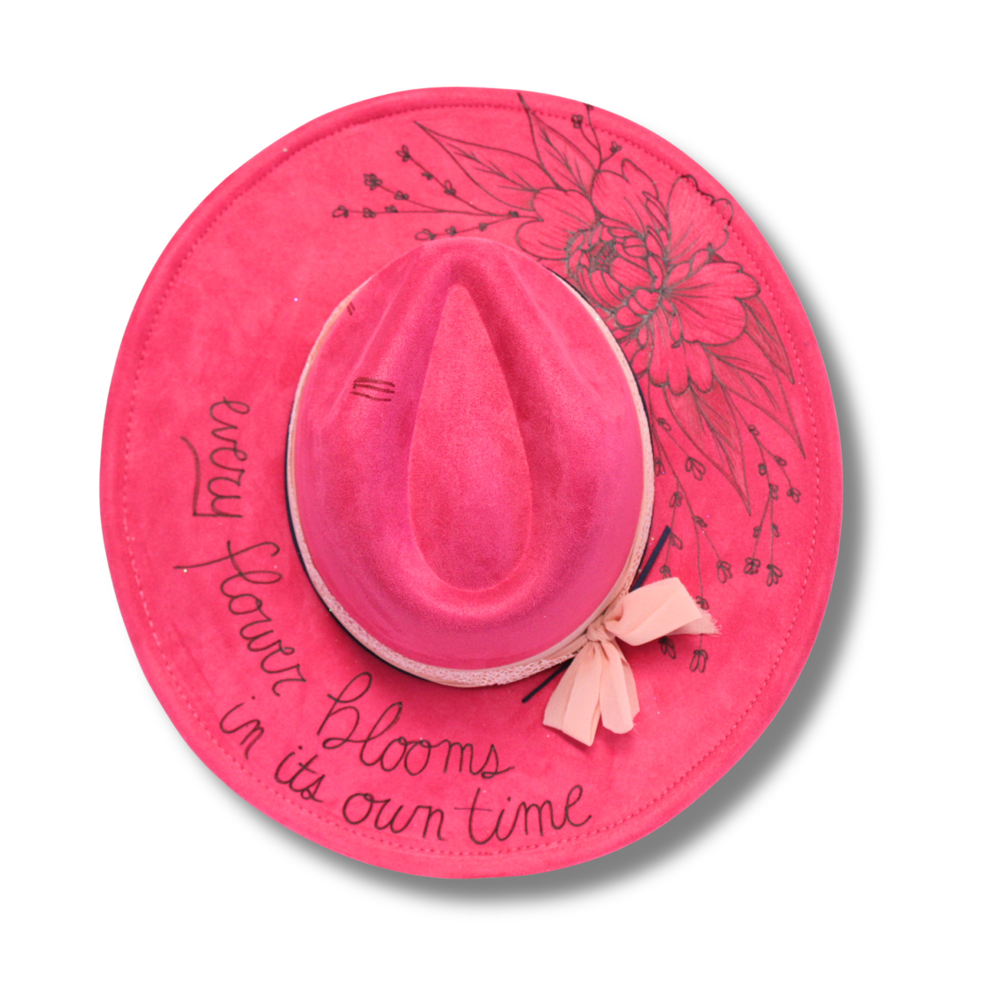 Pink sun hat with floral design and text on a pink circular background