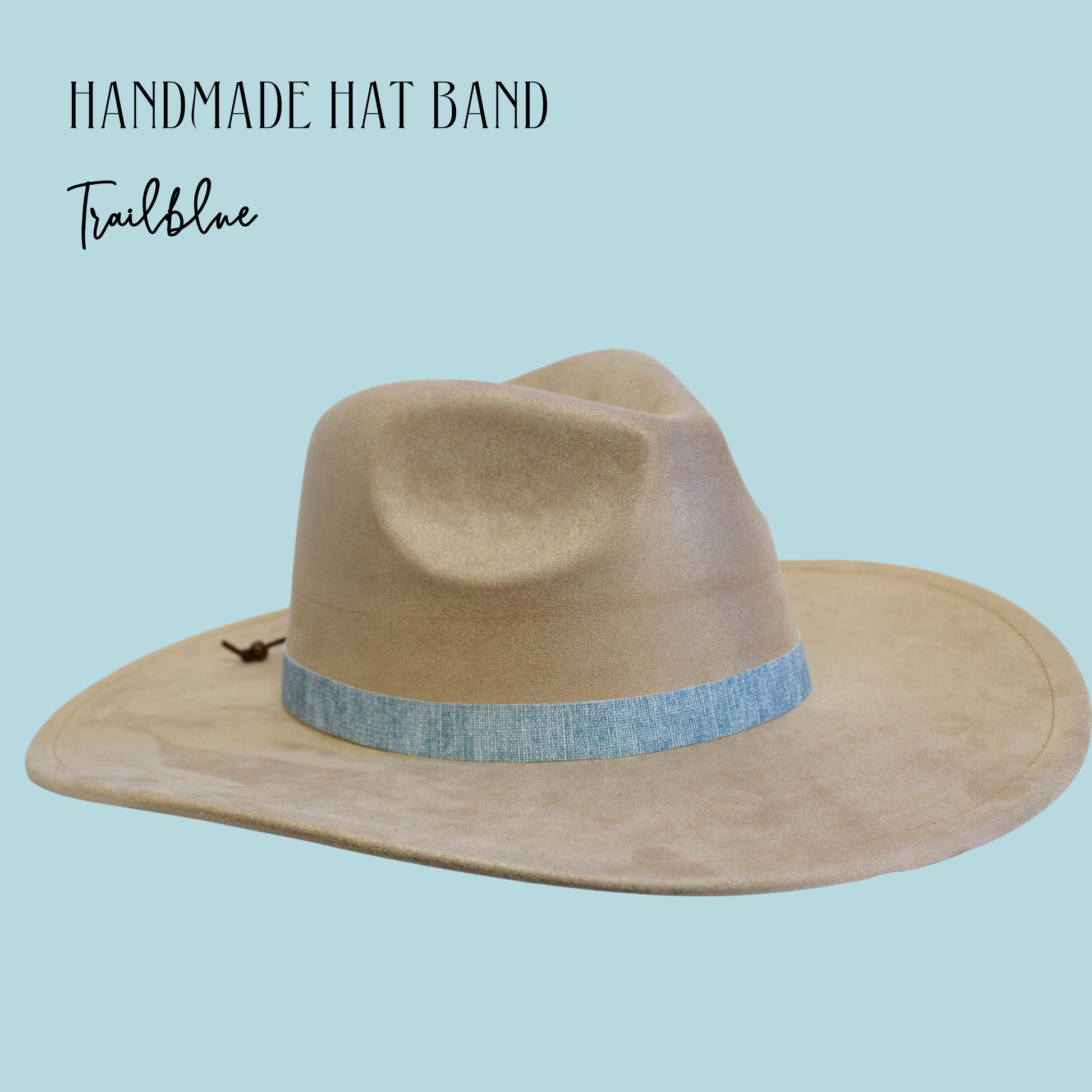 Beige hat with a blue band on a light blue background