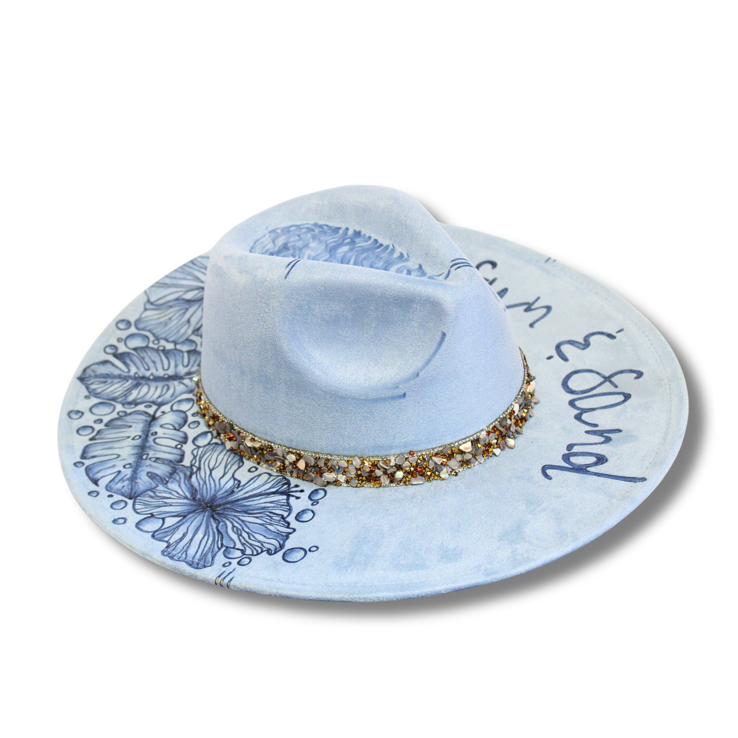 Light blue wide-brimmed hat with floral patterns and gold embellishments on a white background